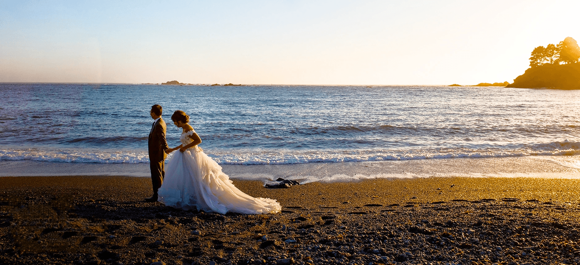 Wedding FAQ — couple on the beach at sunset