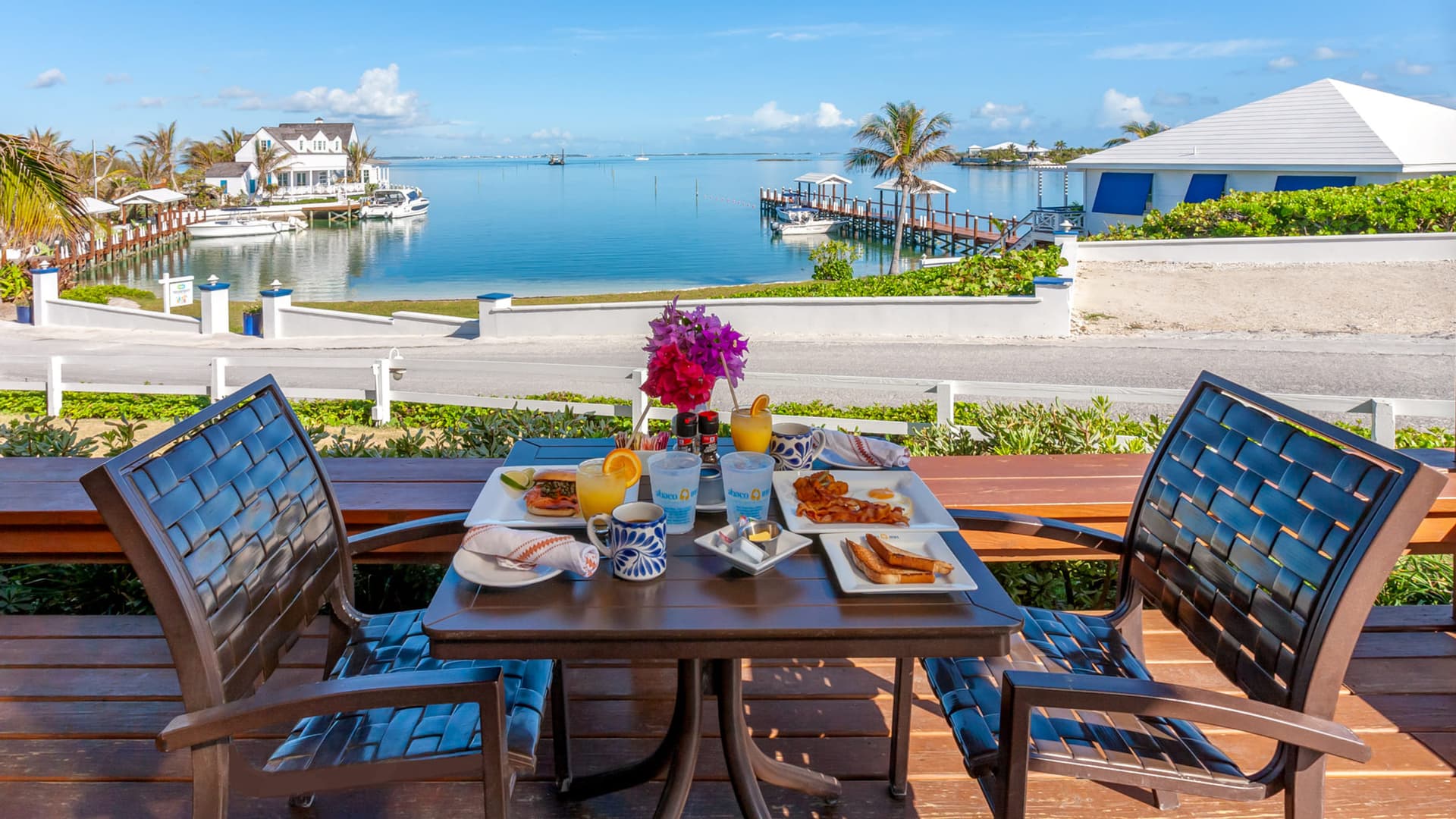A table set on the restaurant deck above the Sea of Abaco