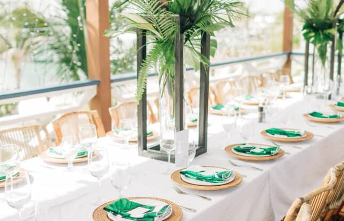 A long table set for a group on the covered deck