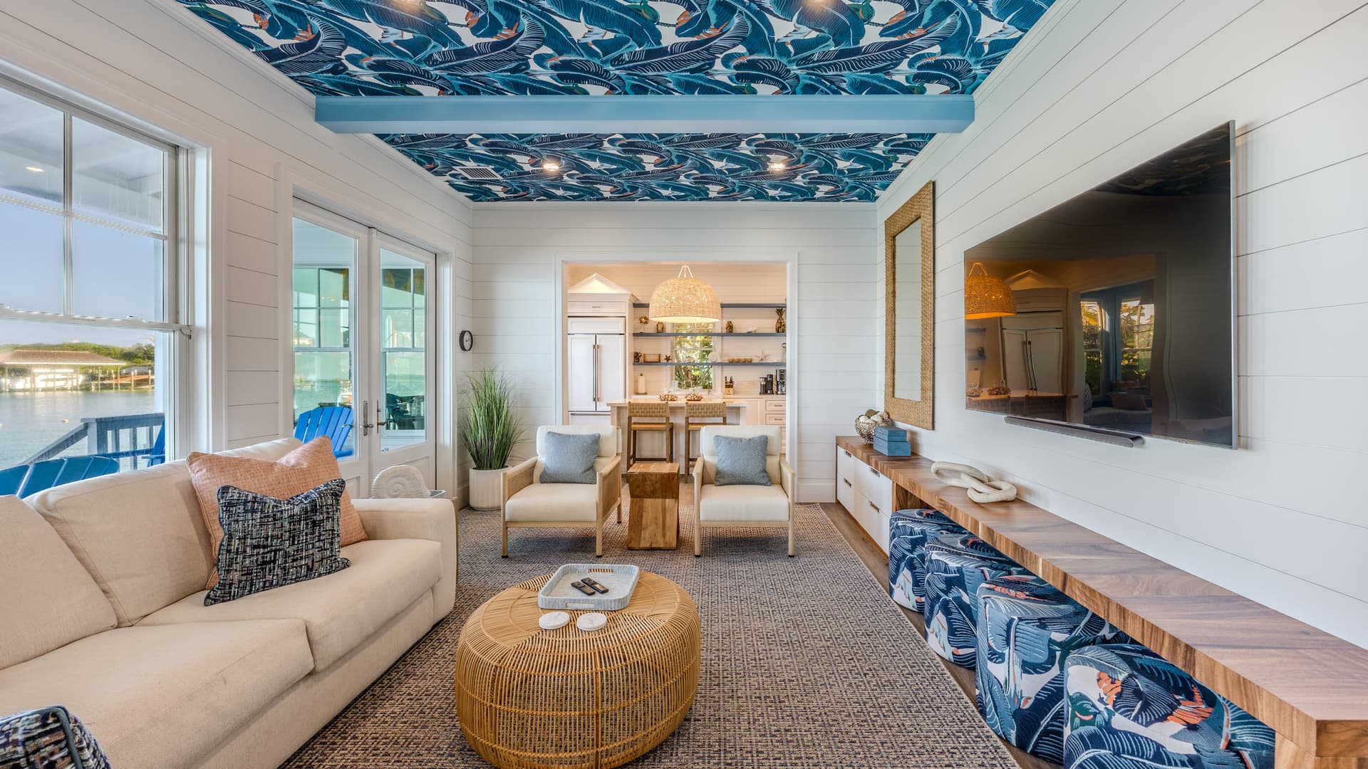 A Sunset Point villa living room with a printed ceiling and open sightline